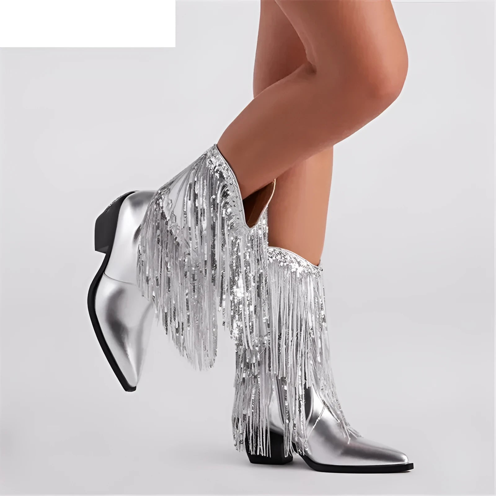 Women's brown chunky heel boots with tassels and pointed toe on a white background.