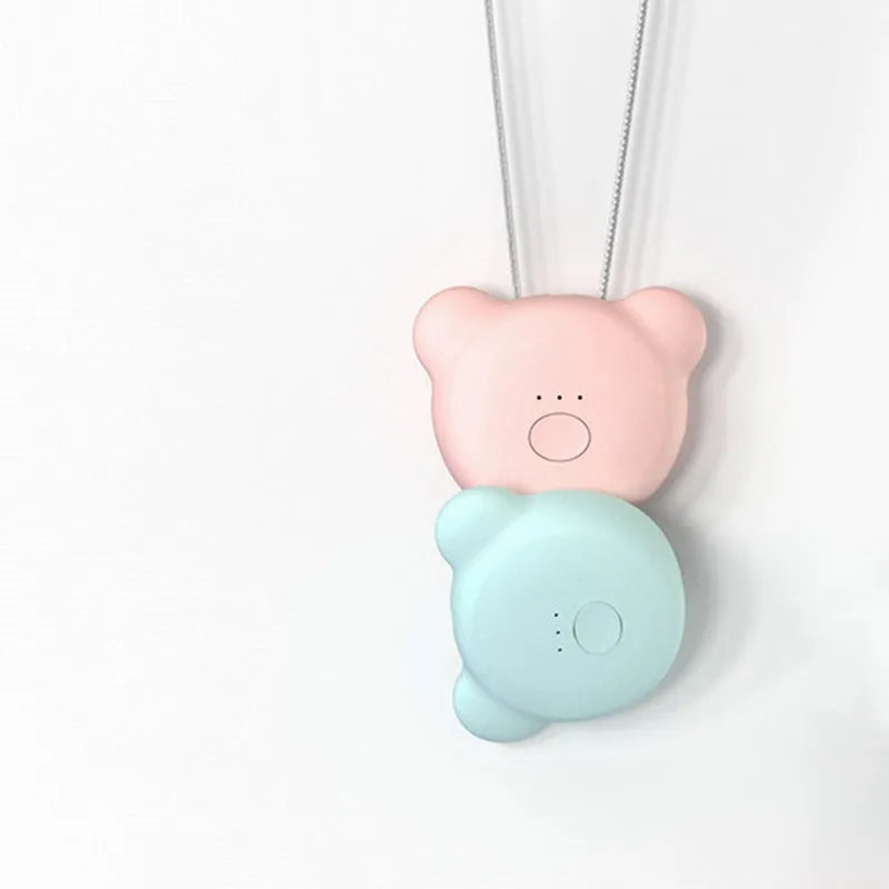 Mini USB portable air purifier necklace in pink, showing compact design with a wearable collar.