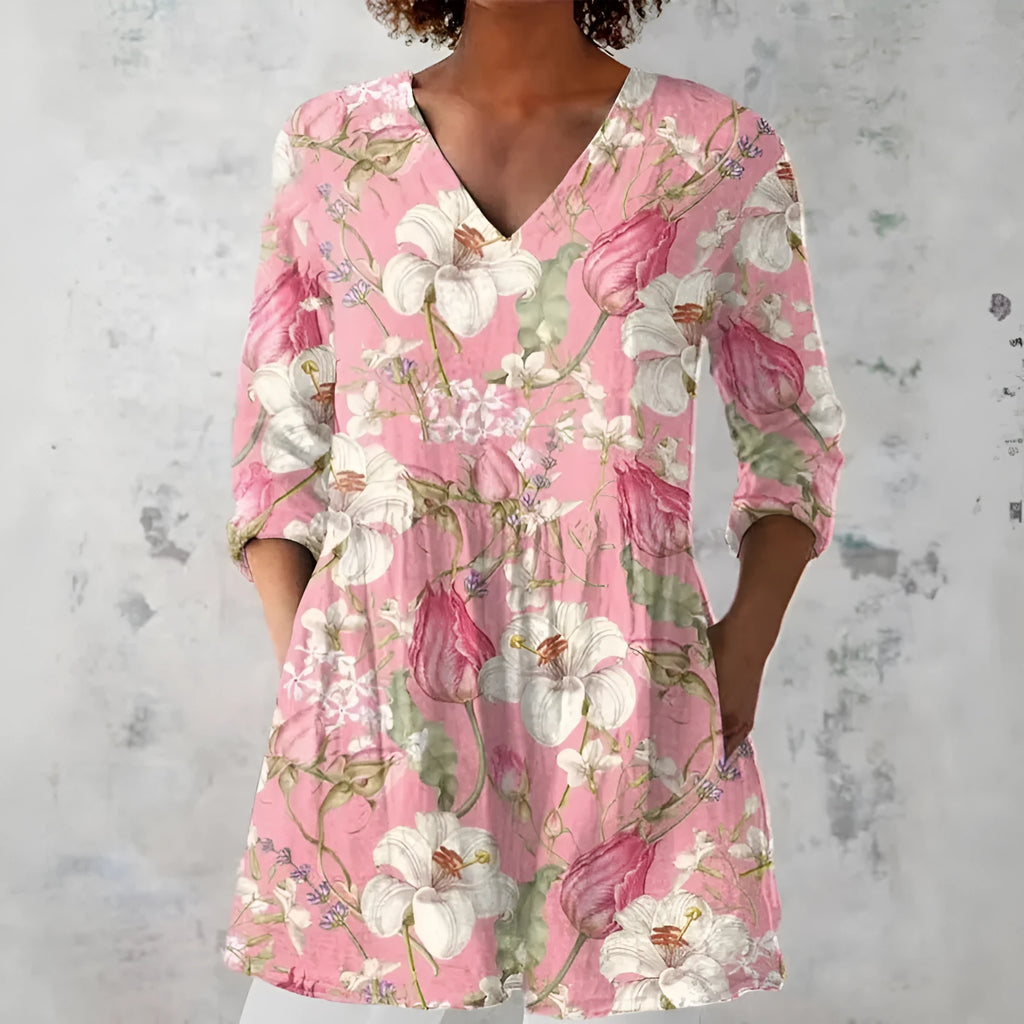 Women's slim-fit retro printed long-sleeved polyester top on a hanger, showing detail of digital print.