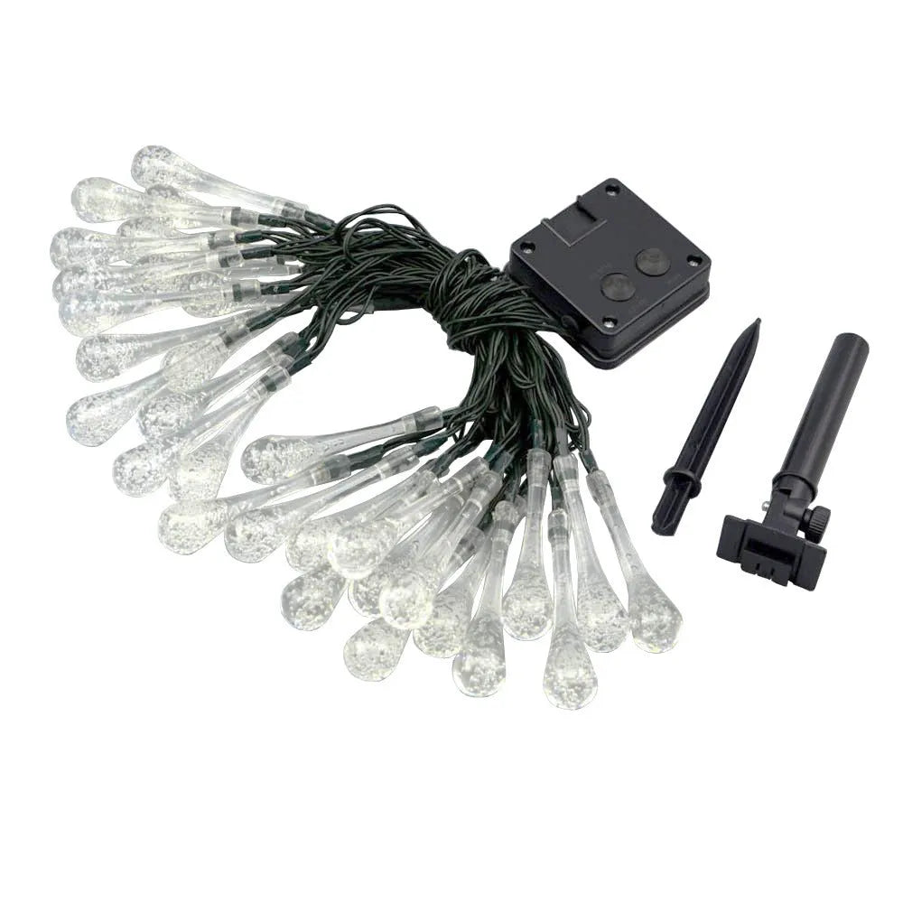 Solar-powered outdoor water drop LED string lights with warm white illumination on 6.5 metre waterproof cord