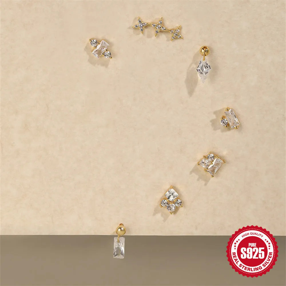 S925 Sterling Silver flower-shaped ear studs with square red gravel stones in a gold electroplated finish.