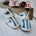 VIP-branded cloth dog sneakers with zipper closures in blue, pink or red colours