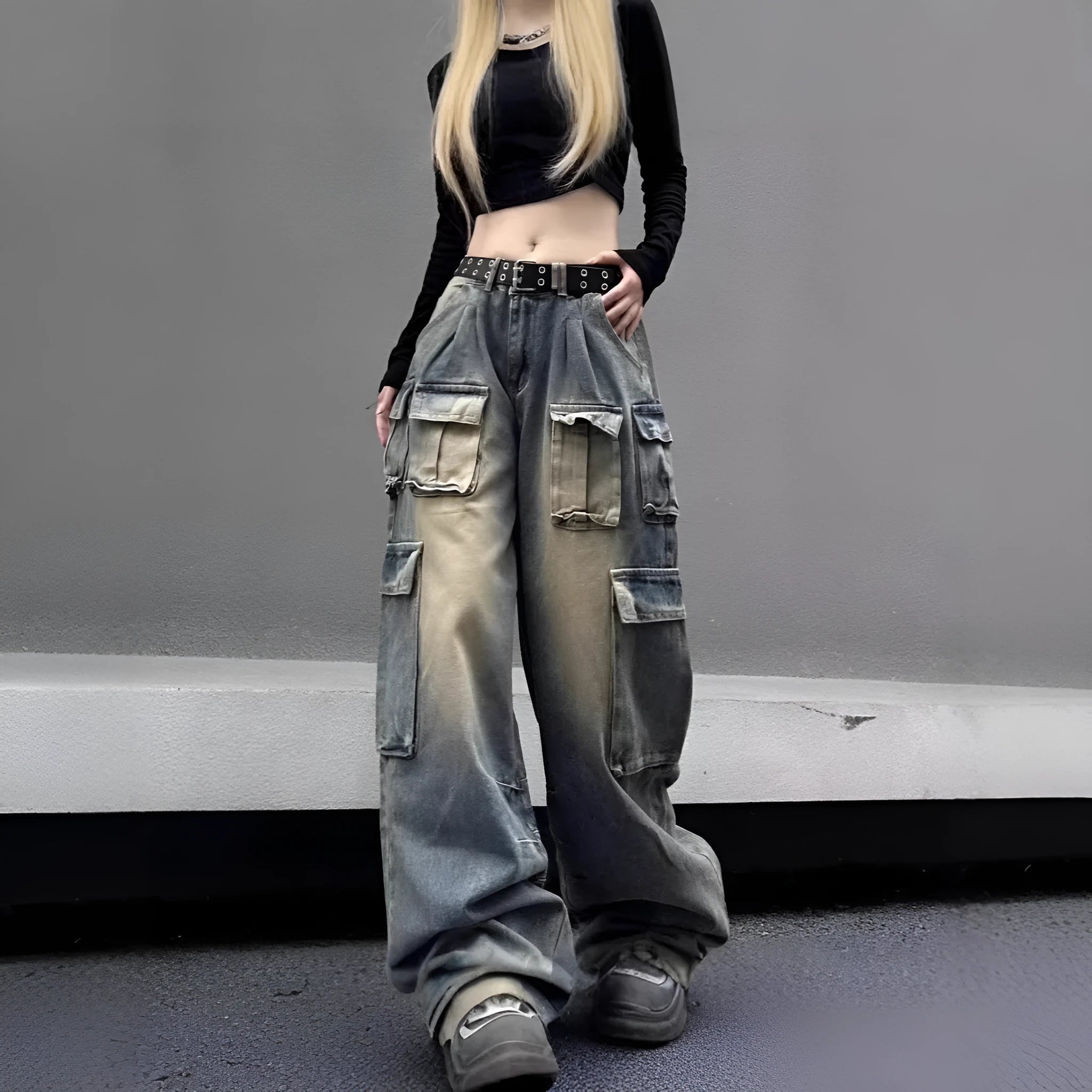 Light blue loose-fit multi-pocket distressed jeans on a hanger