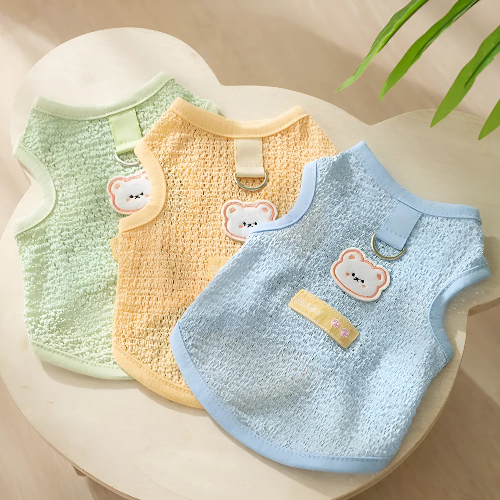 Breathable knitted cat clothing with a hollowed-out cartoon bear patch in blue