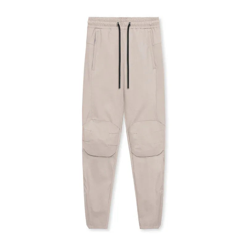Men's loose grey quick-dry fitness trousers with ankle-tied cuffs for running and gym workouts