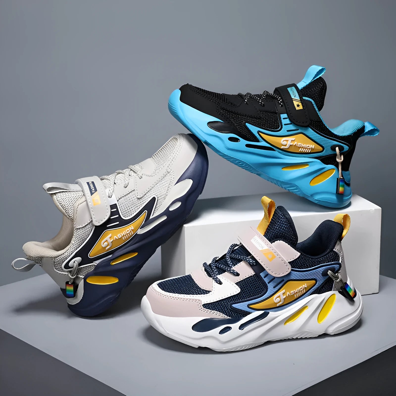 Boys' dark blue and black sports running shoes with velcro strap and mesh upper.