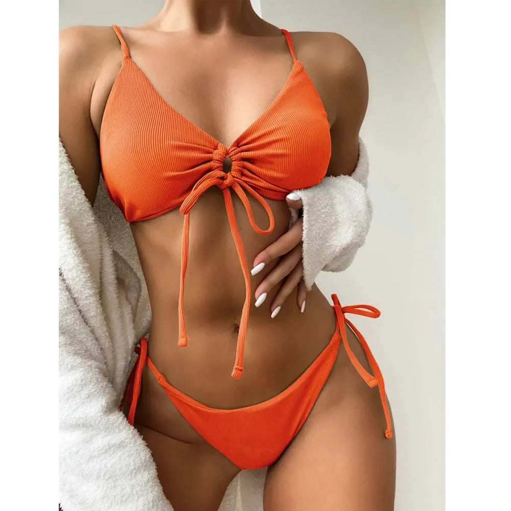 Women's solid colour drawstring bikini swimsuit in quick-dry nylon on a mannequin.