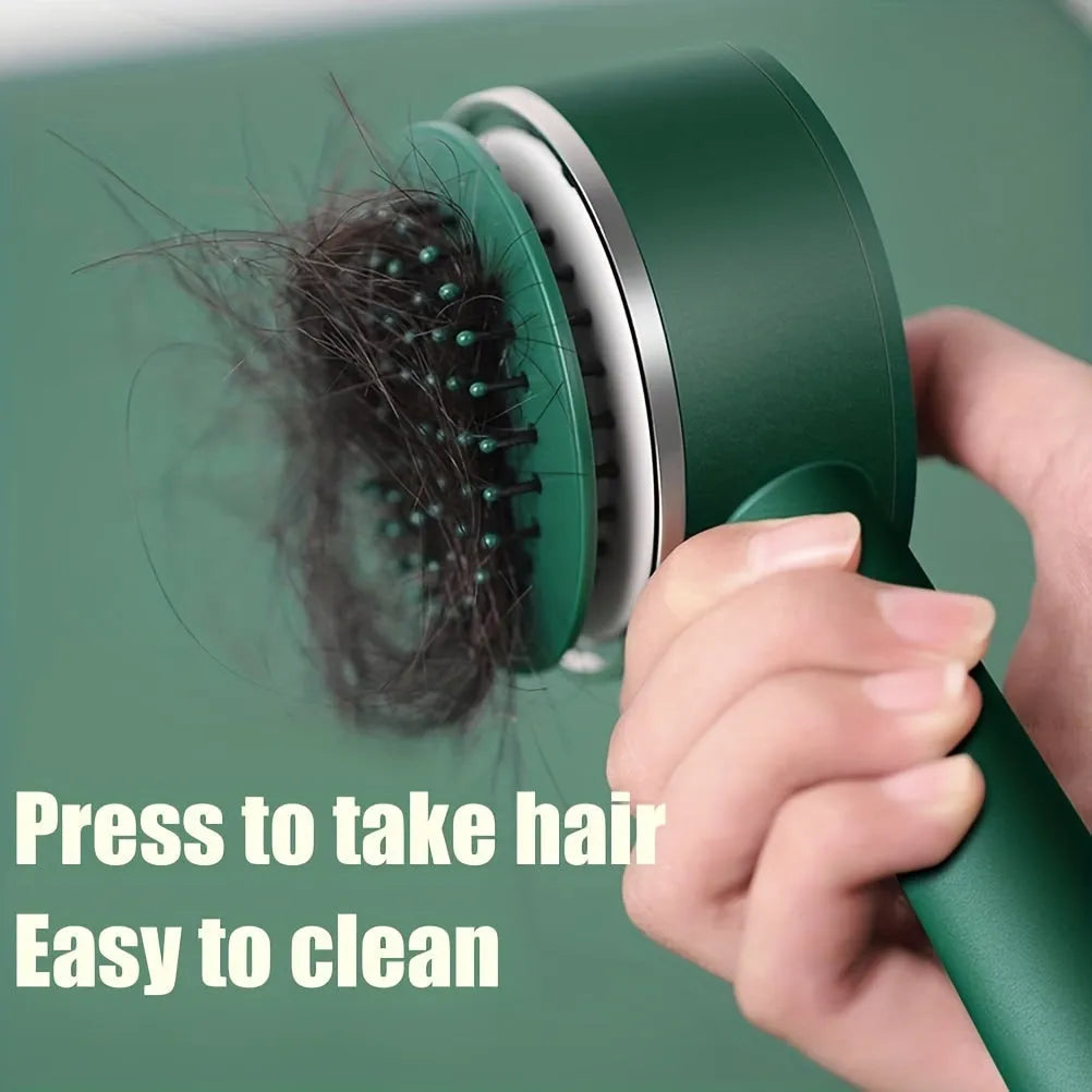 One-key self-cleaning hair brush with green airbag massage comb and non-slip handle on white background