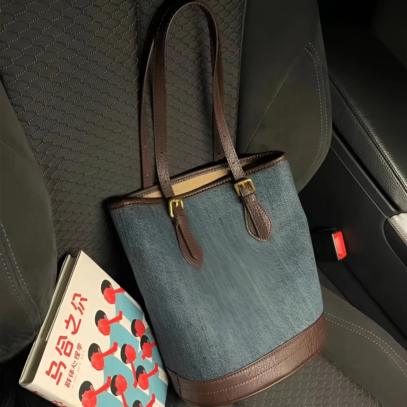 Denim patchwork one-shoulder bucket handbag with polyester construction measuring 23cm by 27cm by 16cm