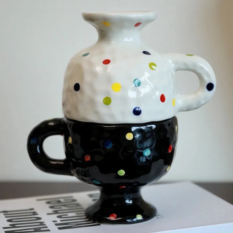 Handmade ceramic mug with irregular shape in solid colour