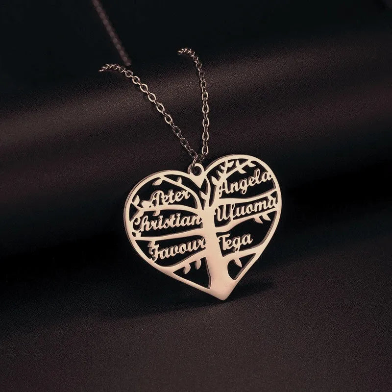 Custom stainless steel name necklace with hollow heart and lucky tree pendant in silver, gold, or rose gold.
