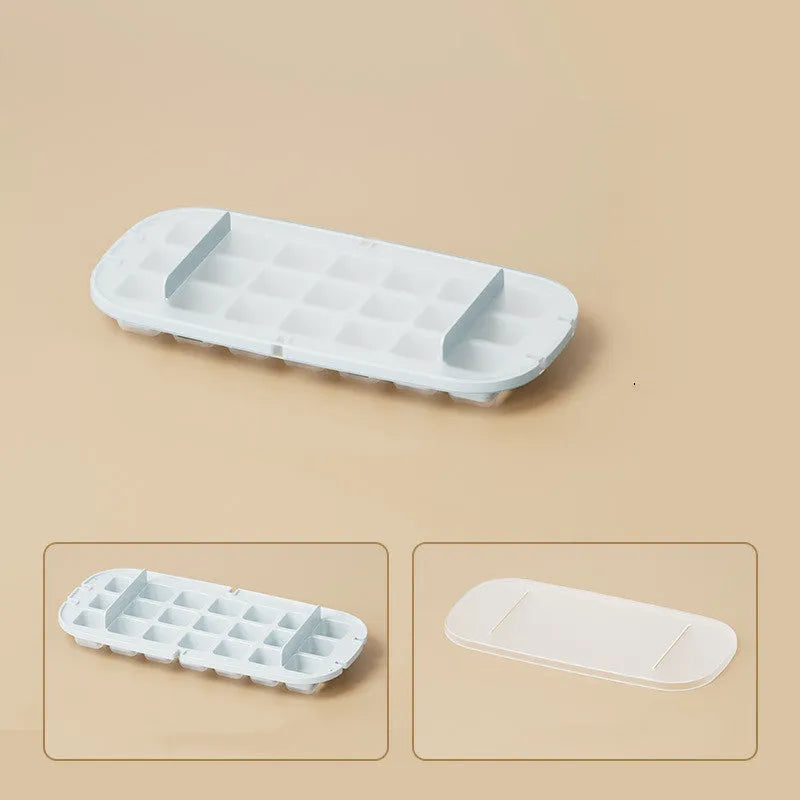 Blue food-grade plastic ice cube tray with grid design and integrated ice shovel storage.