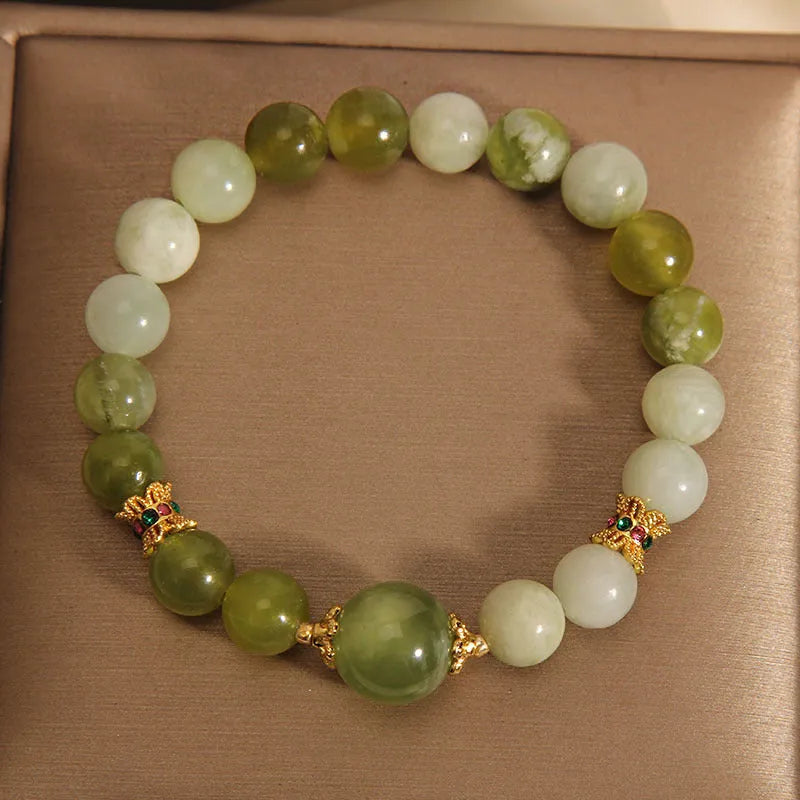 Xiuyan jade women's bracelet in jade green colour with natural stone patterns and Mori-style design
