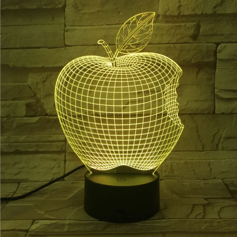 3D fruit-shaped night light with colourful LED glow on a tabletop.