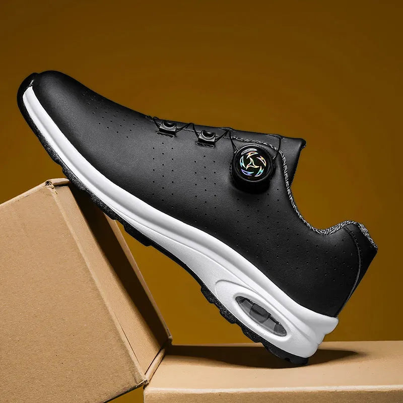 Black and white low-top mesh casual shoes with cross shoulder straps and a composite sole.