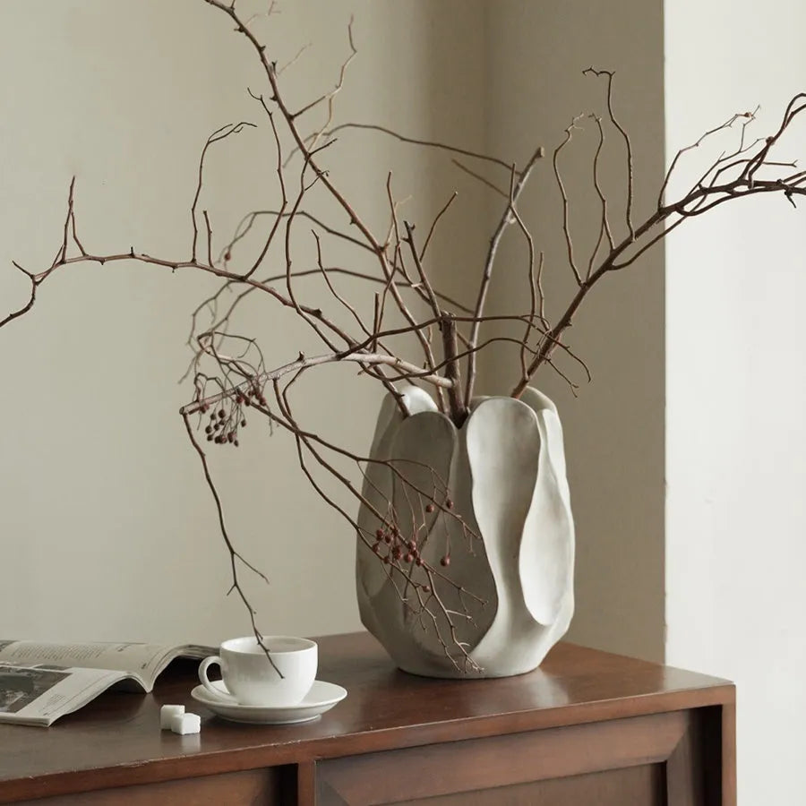 Irregular ceramic vase for flower arrangements in handcrafted design