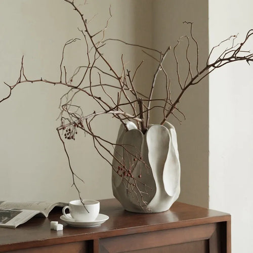 Irregular ceramic vase for flower arrangements in handcrafted design