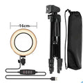 Adjustable aluminium live phone stand extended to various heights between 35 and 110 centimetres.