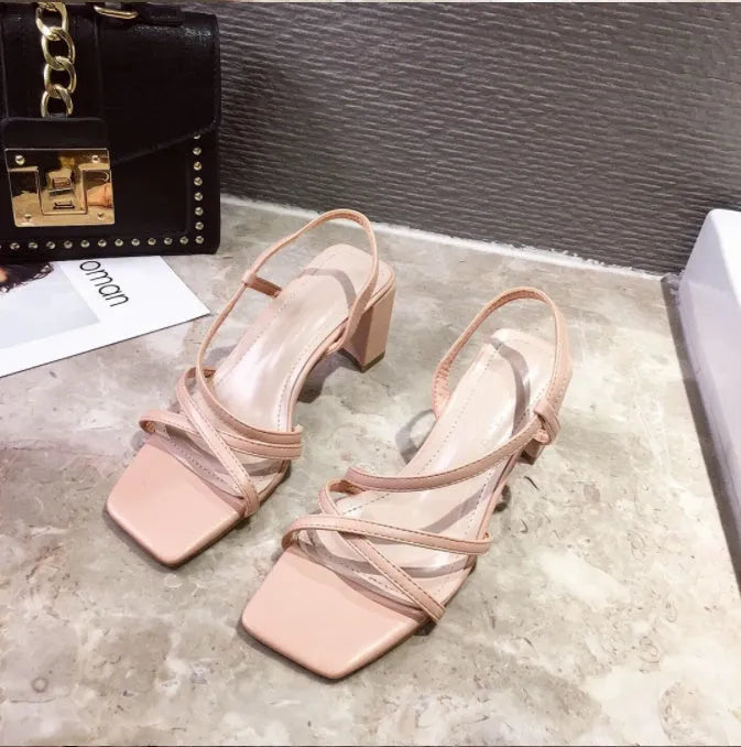 Women's thick heel Roman sandals in apricot colour showing one-strap design and substantial heel