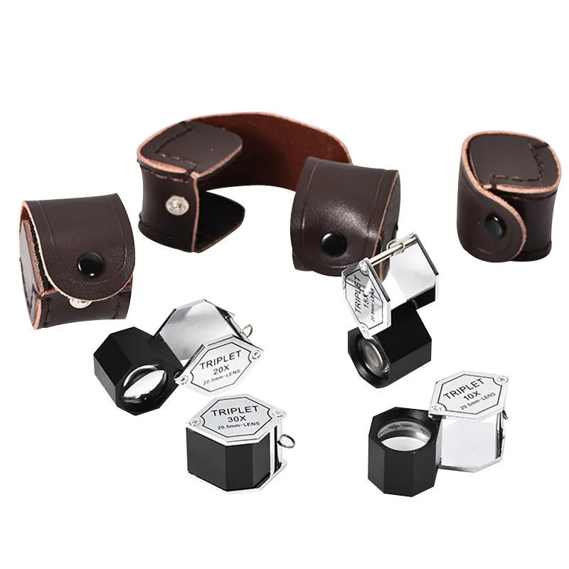 Handheld jeweller's loupe with metal frame and optical glass lenses for 10x to 30x magnification