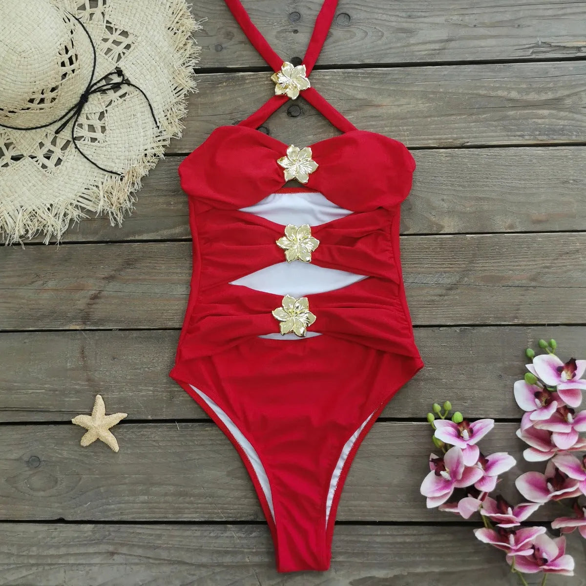 Women's solid colour one-piece swimsuit with a short skirt and hollow-out tube top design.
