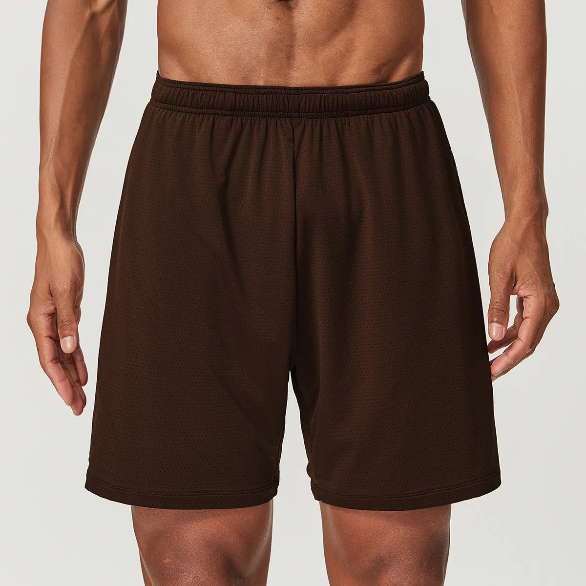 Men's double-layer running shorts in sky green, showing mid-waist fit and shorts length.