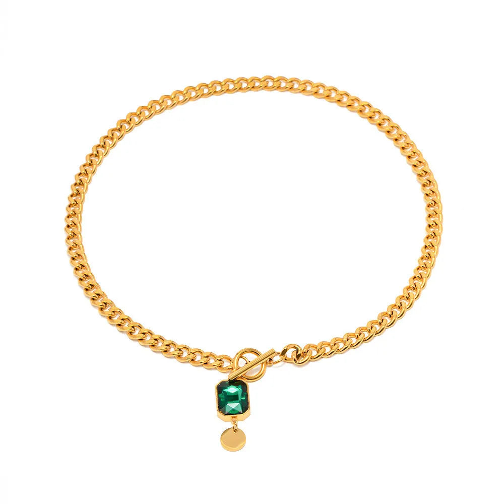 Gold electroplated titanium steel necklace with geometric emerald zircon pendant on Cuban link chain