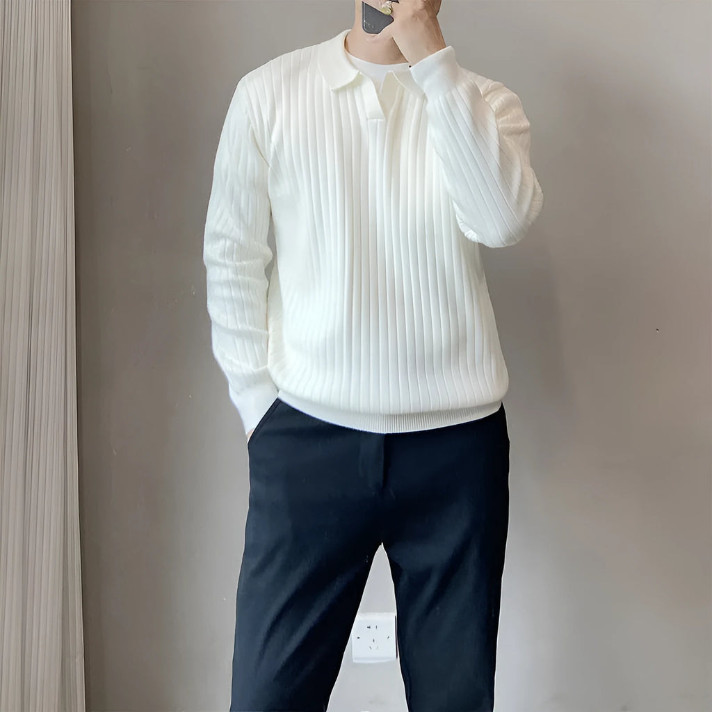 Man wearing a loose grey rabbit fur blend knitted pullover sweater, casual autumn style.