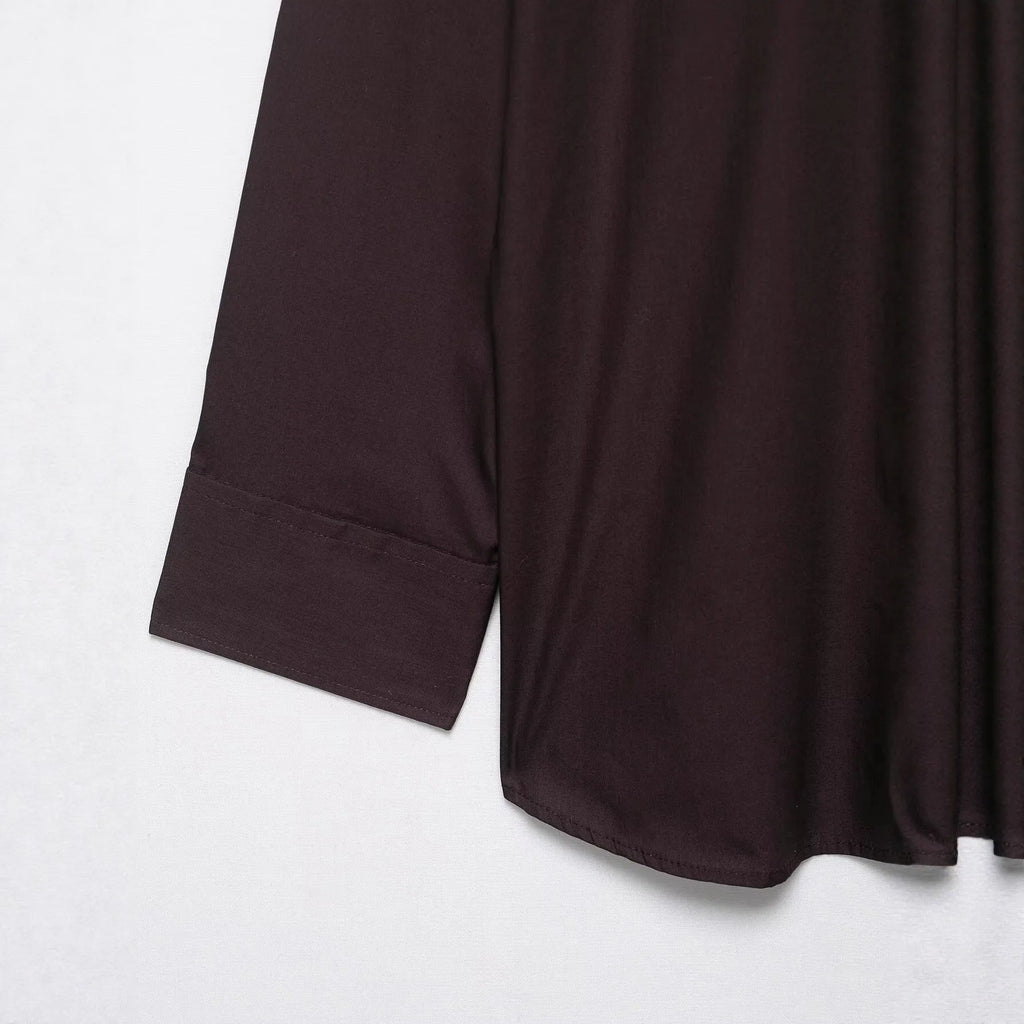 Brown women's loose-fit poplin shirt with long sleeves, cardigan style, and a bow tie detail.