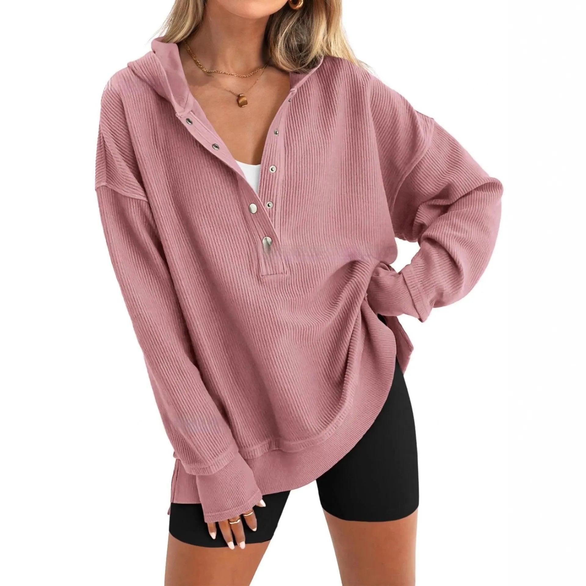 Women's loose fit raglan sleeve sweater in peacock green, shown on a model.