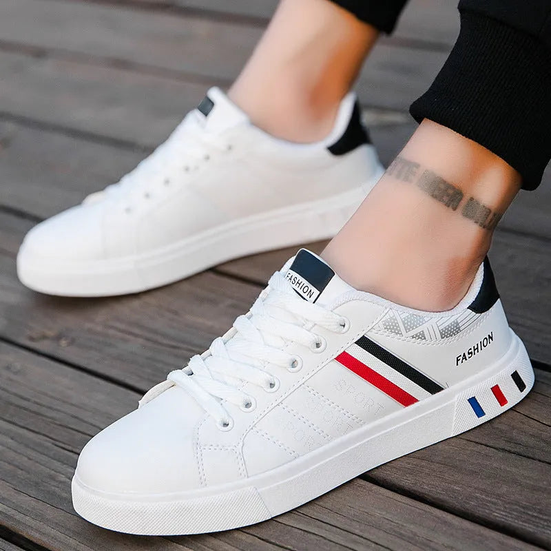 A pair of neutral-coloured sports shoes on a white background, shown in black, grey and white colour options.