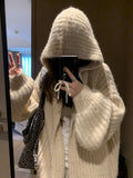 A woman's dark grey hooded cardigan with long sleeves, shown open in a loose fit.