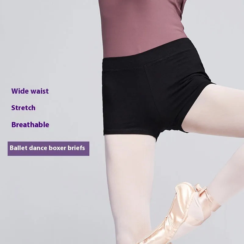 Black cotton ballet dance shorts for women, laid flat showing solid colour and stretch fit.
