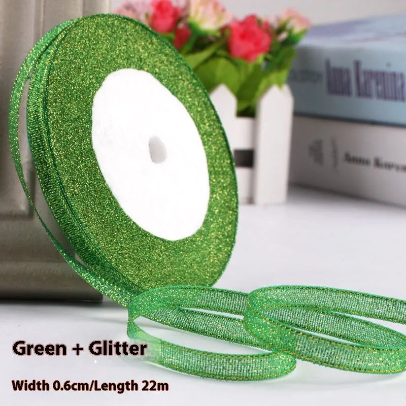Roll of narrow 0.6cm wide polyester gift wrapping ribbon in assorted colours, showing 22 metre length.