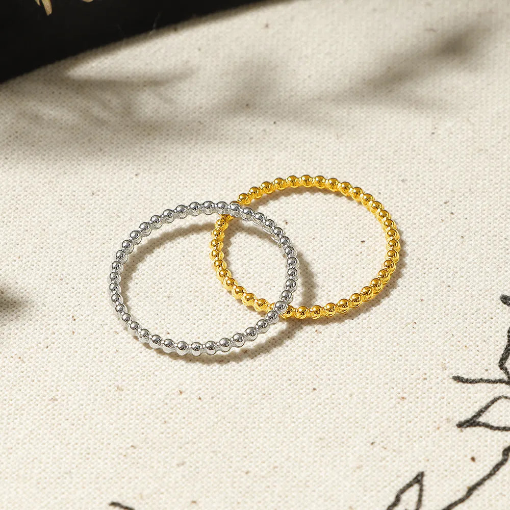 Titanium steel plain circle bead ring in gold colour for women, geometric shape, stackable