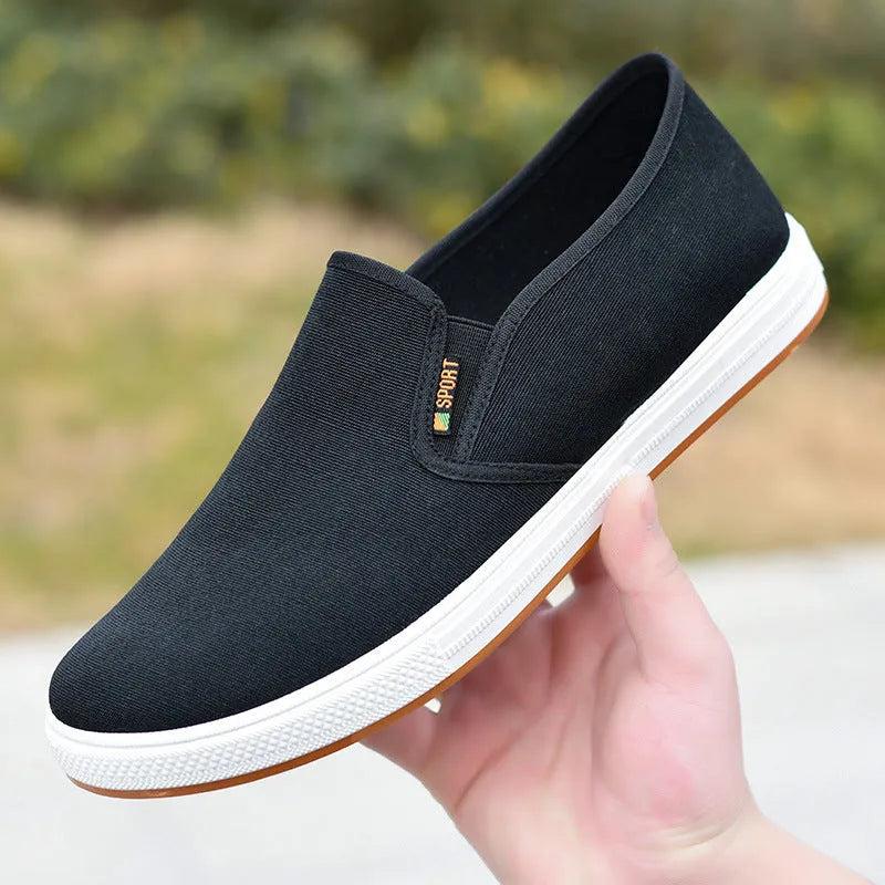 Men's low-top canvas slip-on shoes in BK Black colour with round toe design