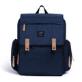 LAND Mommy large grey diaper backpack with changing mat, shown with baby care items.