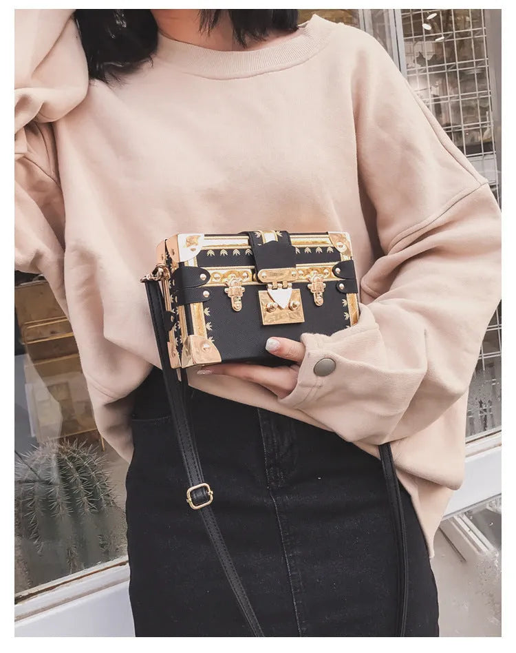 Women's black PU leather shoulder bag with flap closure and decorative rivets