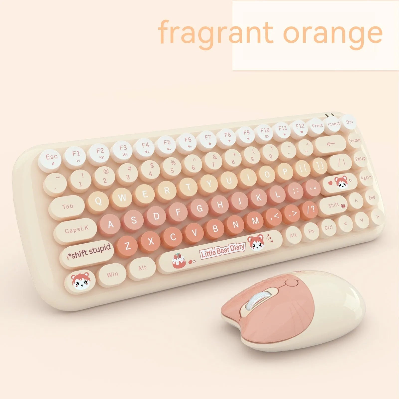 Candy pink wireless keyboard and mouse set on a desk next to a notebook computer.
