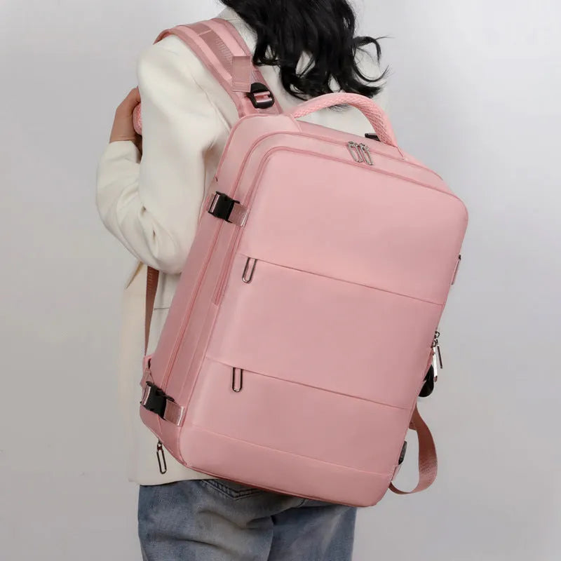 Large-capacity purple travel backpack for women with multiple compartments and an air pillow shoulder strap.
