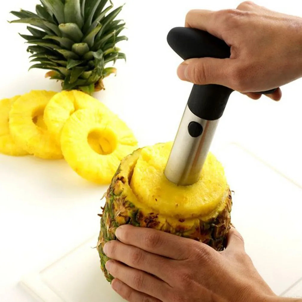 Stainless steel pineapple peeler with black handle and coring blade, 83.7 mm width, shown on white background