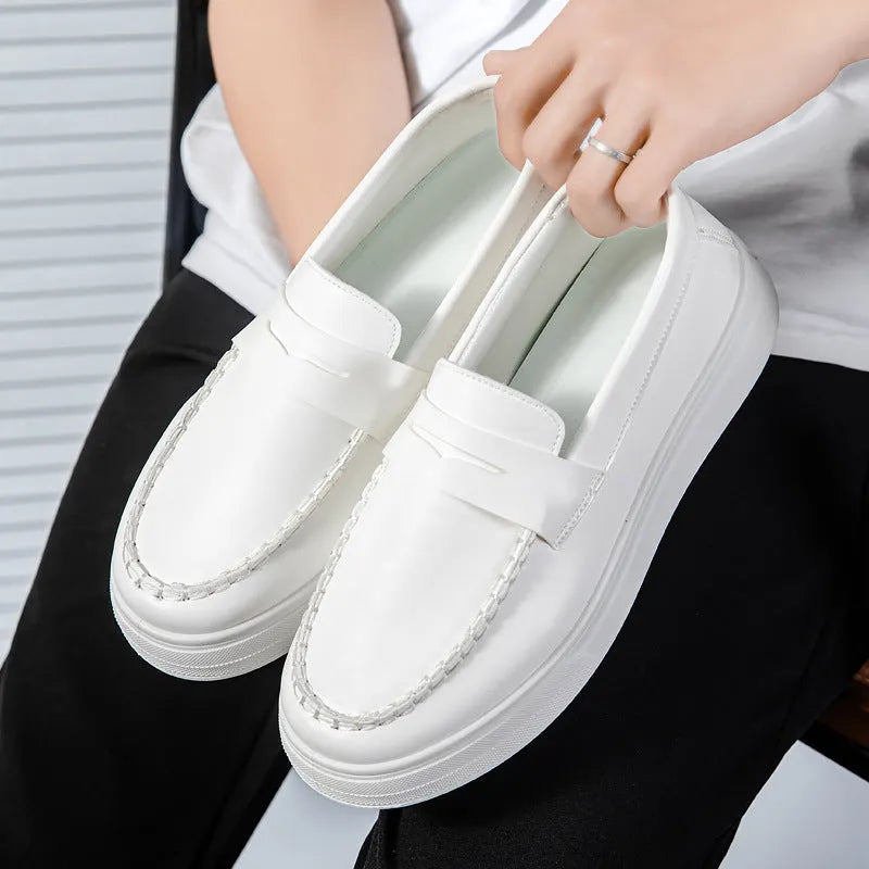 Men's white PU leather slip-on loafers with round toe on a solid background.