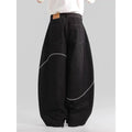 Black straight-leg denim trousers with a mid-waist and zip fly on a mannequin.