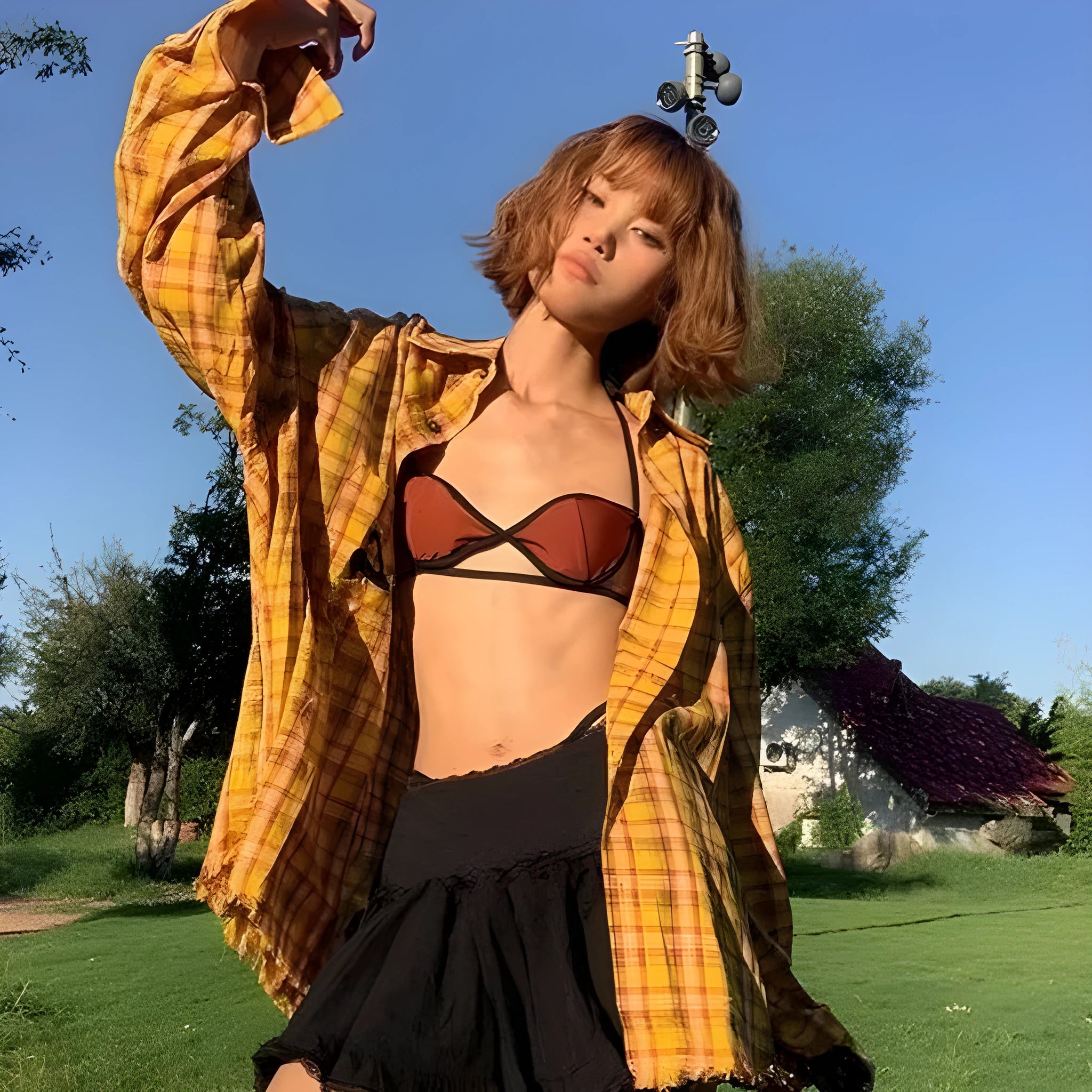 Dopamine yellow plaid shirt on a hanger, showing loose cardigan-style fit.