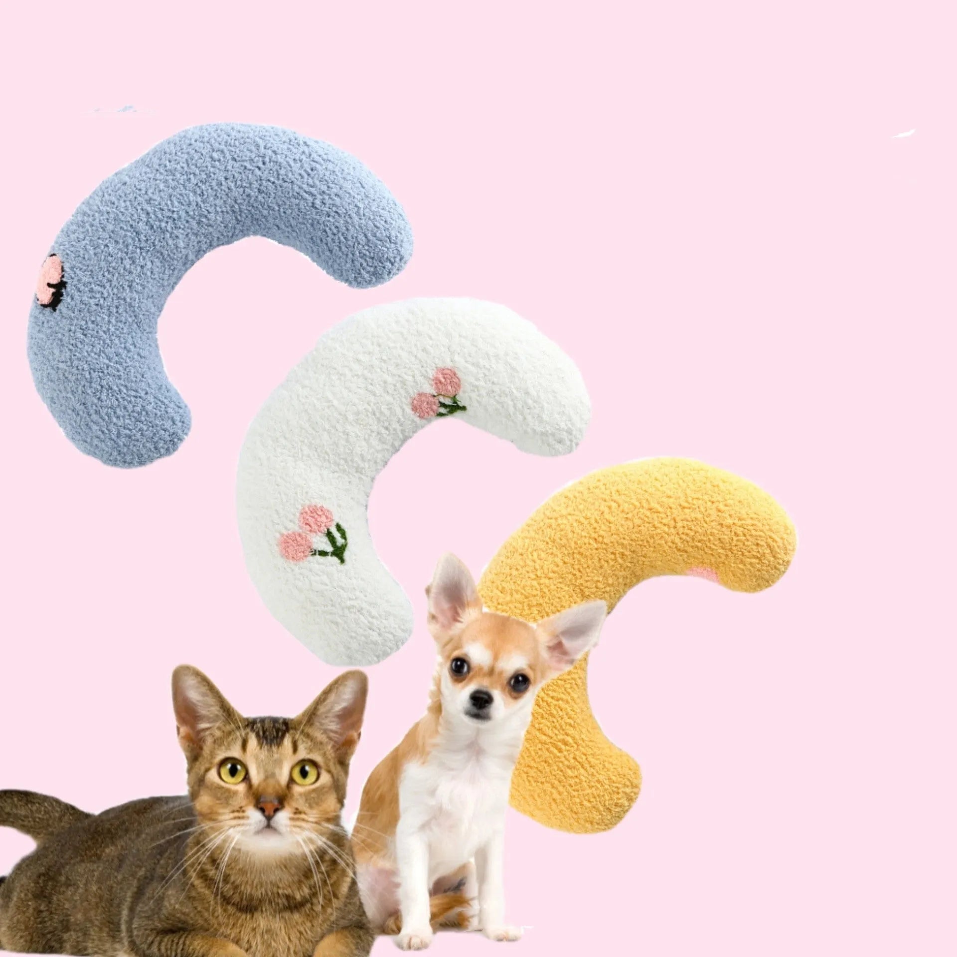 Small white U-shaped plush pet pillow for cats and small dogs on a neutral background.