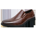 Men's black pointed leather casual shoes with flat rubber sole, shown from side