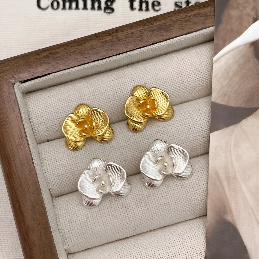 Retro flower fashion earrings for women in gold or silver colour with detailed petal design