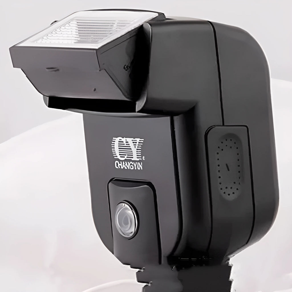 Silver top-mount SLR camera flash accessory with head tilted up, showing hot shoe mount and battery compartment.