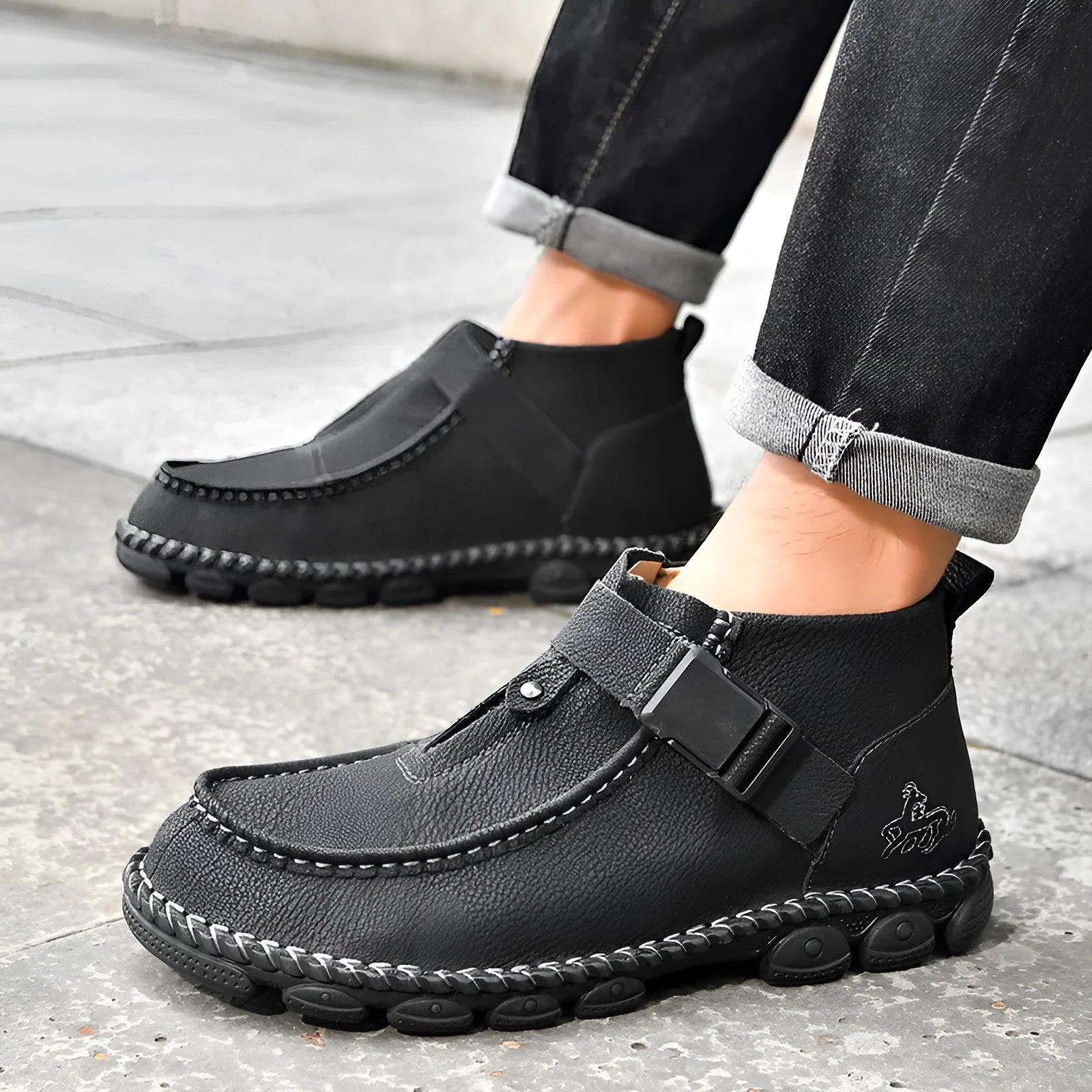 Men's black casual slip on loafers with visible stitching and a flat sole.