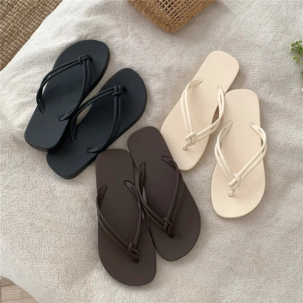 Men's PVC toe covering flip flops in beige on a plain background, showing non-slip sole.